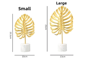 Detailed size specifications for gold monstera leaf metal decor with marble bases