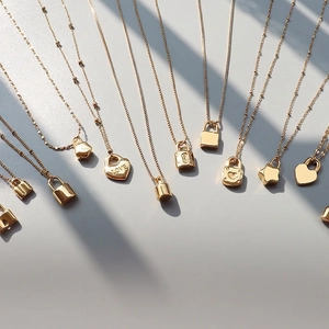 18K gold plated titanium necklaces featuring heart and star pendants with rhythmic shadows
