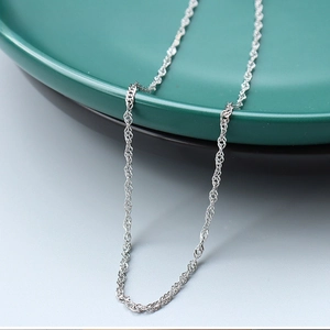 Detail view of 1.9mm silver water wave chain necklace in polished stainless steel