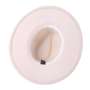 Detail of the inner lining and fabric label on a stylish beige wide-brim fedora hat