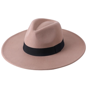 Close-up of camel wool felt fedora hat featuring a wide brim and black ribbon band