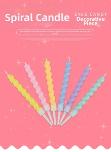 Detailed view of colorful spiral birthday candles with white holders in macaron colors