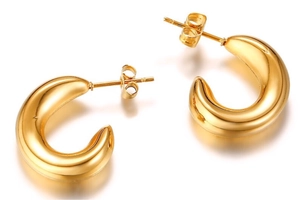 Detailed view of polished 18k gold plated hollow C-shaped earrings on white background