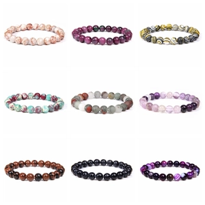 Detail showcasing nine unique styles of 8mm natural stone elastic beaded bracelets