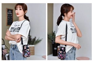 Detailed view of women's floral mini crossbody phone bag with multi-layer zipper pockets