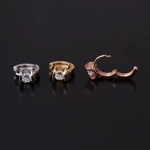 Detailed view of hinged hoop earrings in silver, gold, and rose gold with zircon stones