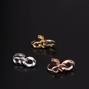Detailed view of chunky chain link ear cuffs in gold, silver, and rose gold finishes