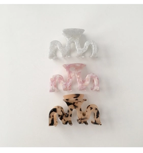 Medium acetate hair claws in white marble, pink swirl and tortoiseshell patterns