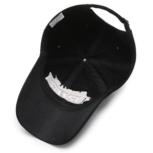 Internal view of a washed black cotton baseball cap with Trump embroidery and white lining