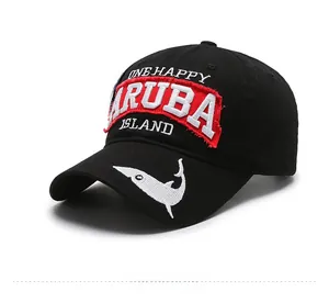 Close-up of black cotton baseball cap with Aruba embroidery and shark detail on the brim