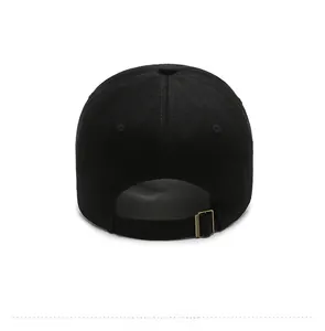 Rear view of black washed baseball cap showing metal buckle and adjustable strap