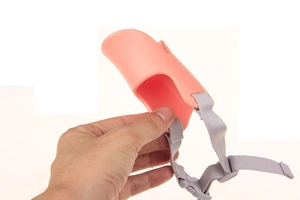 Pink duckbill dog muzzle with adjustable grey strap for barking and biting control