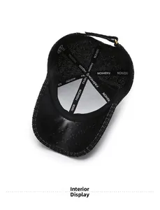 Detail view of black baseball cap interior with mesh lining and adjustable strap