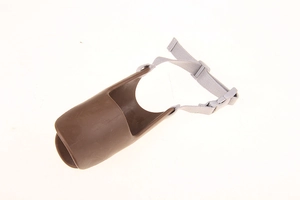 Detail view of brown duckbill dog muzzle with adjustable grey strap and secure buckle