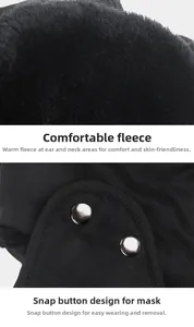 Detail of warm black trapper hat with thick faux fur lining and metal snap mask buttons