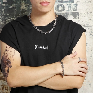 Punk style stainless steel chain necklace and bracelet set shown on model in black top