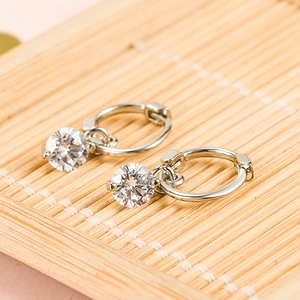 Elegant silver hoop earrings featuring a single round zircon pendant on bamboo texture
