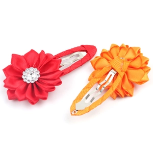 Floral fabric hair clips for kids with rhinestone accents on a clean white background