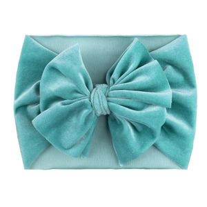 Teal velvet soft nylon headband with large bow for baby girls on a white background