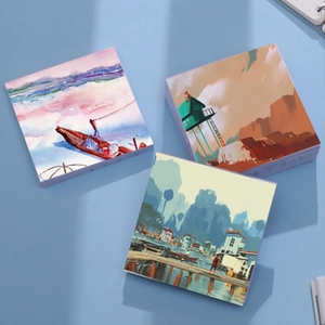 Detailed view of mini memo pads featuring artistic landscape illustrations on covers