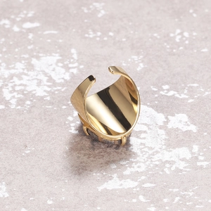 Adjustable gold ring featuring a faceted grey natural stone in a four-prong setting