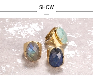 Macro detail of vintage adjustable rings with faceted labradorite and lapis lazuli stones