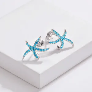 Elegant 925 sterling silver starfish stud earrings featuring bright blue stones