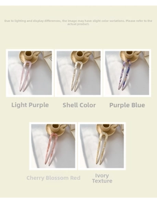 Detail of U-shaped acetate hairpins in five marbled colors like lilac and shell
