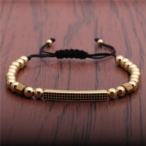 Adjustable woven bracelet with gold beads and black micro-pave zircon bar pendant