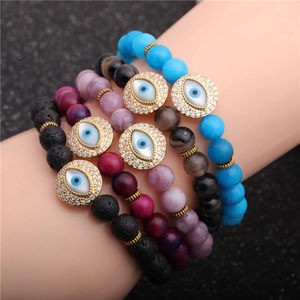 Five-piece beaded bracelet set with natural agate, lava stones, and crystal evil eye charms