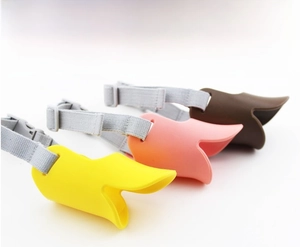 Detailed view of colorful duck-billed silicone muzzles with adjustable straps for dogs
