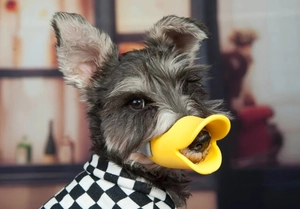 Detailed view of yellow duckbill dog muzzle in soft silicone for gentle anti-bark protection