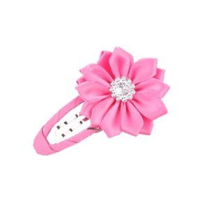 Detail of pink fabric flower hair clip with sparkling rhinestone center for girls