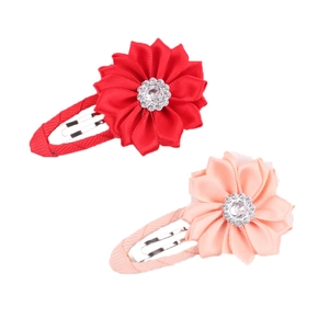 Detail of fabric flower hair clips with rhinestones and ribbon-wrapped metal BB clips