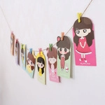 Cartoon girl illustration cards with colorful wooden clips and jute rope for photo walls