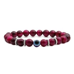 8mm red tiger eye beaded bracelet with blue evil eye charm and silver spacers on white background