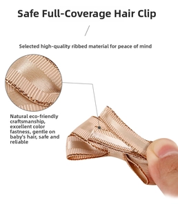 Detail of baby hair bow clip with champagne gold grosgrain ribbon and full-wrapped safety design