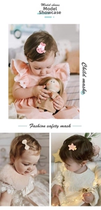 Detail of pink rabbit, beige bow and yellow star hair clips on a baby girl
