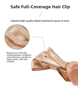 Macro detail of champagne baby hair clip with safe full-wrapped grosgrain ribbon