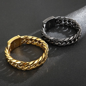 Men's stainless steel curb chain bracelets in gold and black on a dark background