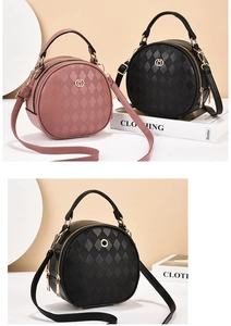 Close-up of quilted PU leather round bag with dual zippers and gold hardware detail