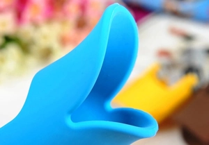 Close-up of soft blue silicone duck-shaped dog muzzle edge with matte texture