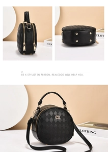 Detail of round quilted crossbody bag with golden hardware and protective bottom studs