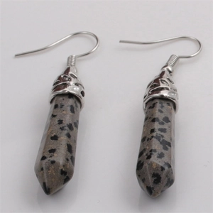 Detail of stone drop earrings featuring hexagonal speckled jasper pendants and silver hooks