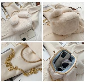 Detailed view of beige plush rabbit bag with gold hardware and internal storage space