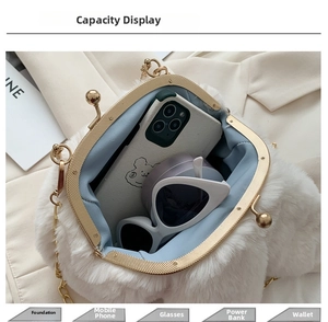Top view of plush white rabbit ear bag showing interior space with gold metal clasp