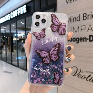 Close-up of iPhone case with purple liquid glitter, heart sequins, and butterfly motifs
