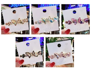 Detailed view of handmade crystal butterfly hair clips in five sparkling color variants