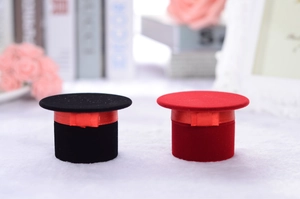 Miniature top hat jewelry gift boxes in red and black flocking with silk ribbons