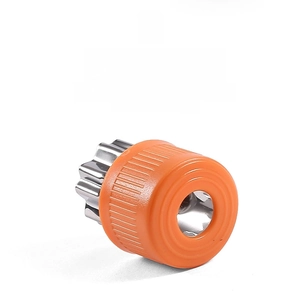 Detail of stainless steel vegetable cutter with orange protective handle for safe baking
